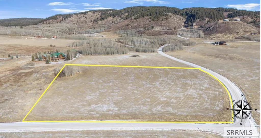 Aerial of the parcel from the west, mountain ridge behind.